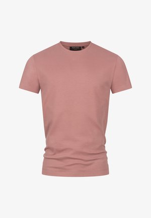 T-shirt rosa in cotone con scollo rotondo, maniche corte e design aderente. Texture liscia; nessun motivo o accentuazione visibile.