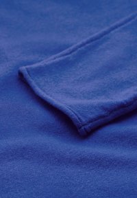 Blue fleece fabric with a soft texture. The image shows a folded corner with visible stitching and a smooth, even surface.