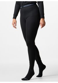 Black ribbed leggings with a fitted design, featuring a wide waistband labeled "SWEDEMOUNT." The fabric appears smooth and stretchy.