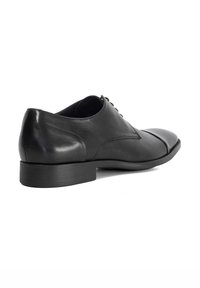Black leather dress shoe featuring a rounded toe, smooth texture, and a low, stacked heel. Laces run along the upper side.