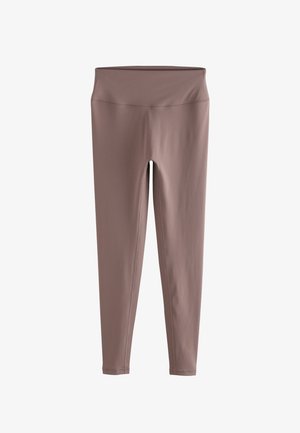 Bruine leggings van rekbaar materiaal, met een hoge tailleband en een gladde textuur. Geen patronen of extra accenten aanwezig.