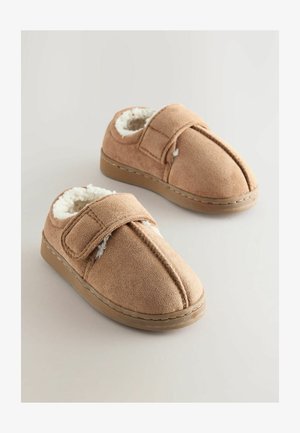 Tan spalvoti šlepetės su minkšta dirbtinės pūkos pamušalu, turinčios velcro dirželį ir apvalią nosį. Plokščias padas su siuvinėtomis kraštinėmis.