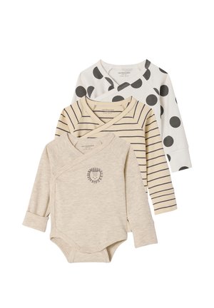 Three long-sleeve baby bodysuits in beige with lion print, beige with navy stripes, and white with large black polka dots, layered together.