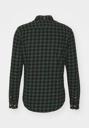 Grønn og svart rutete langermet skjorte med krage, knappeendinger og buet kant. Laget av mykt, teksturert stoff.
