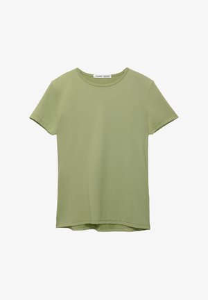 T-shirt med korte ærmer og rund hals i lys grøn, lavet af glat stof med en afslappet pasform. Har en lige kant og minimal detaljer.