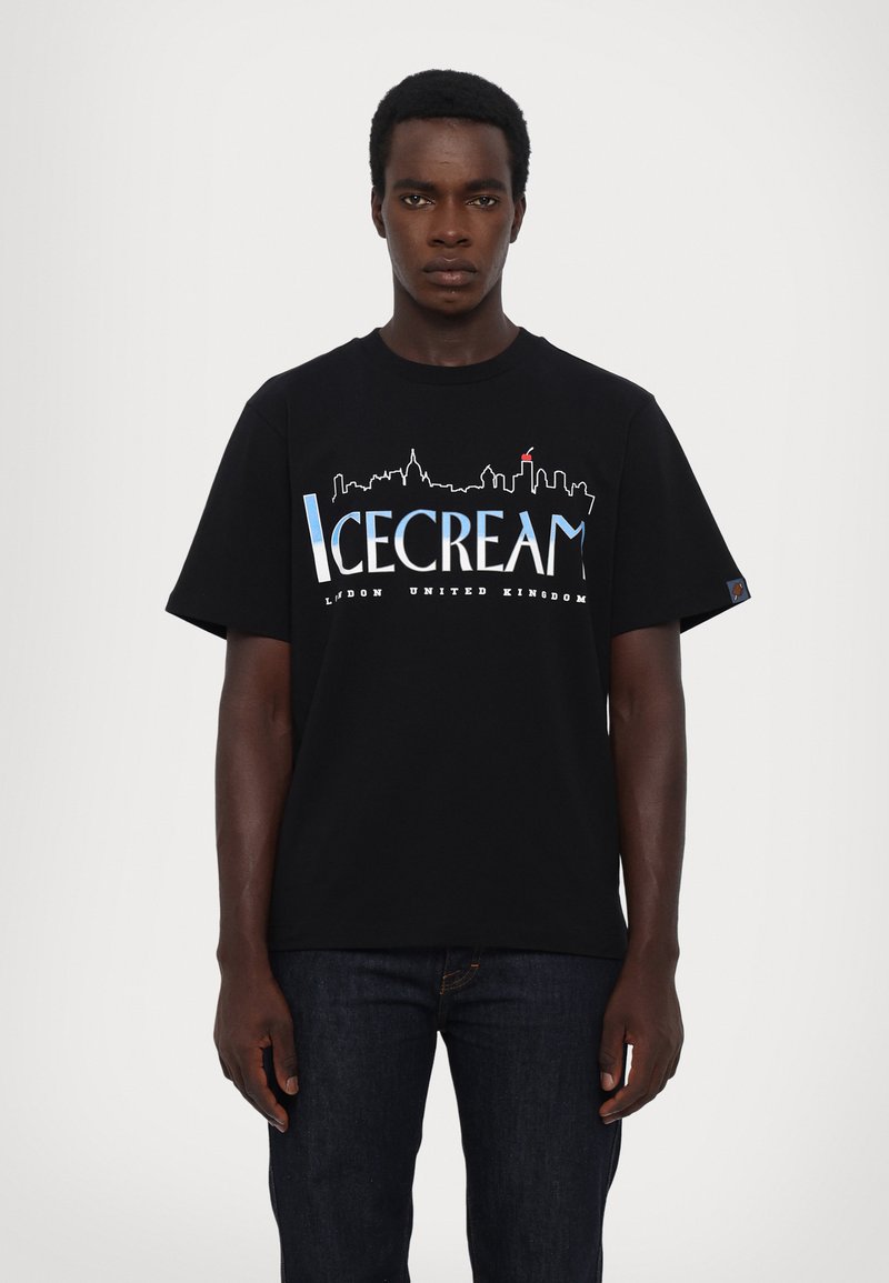 Black cotton t-shirt featuring a graphic of a skyline and the word "ICECREAM" in blue and white text. Short sleeves, relaxed fit.