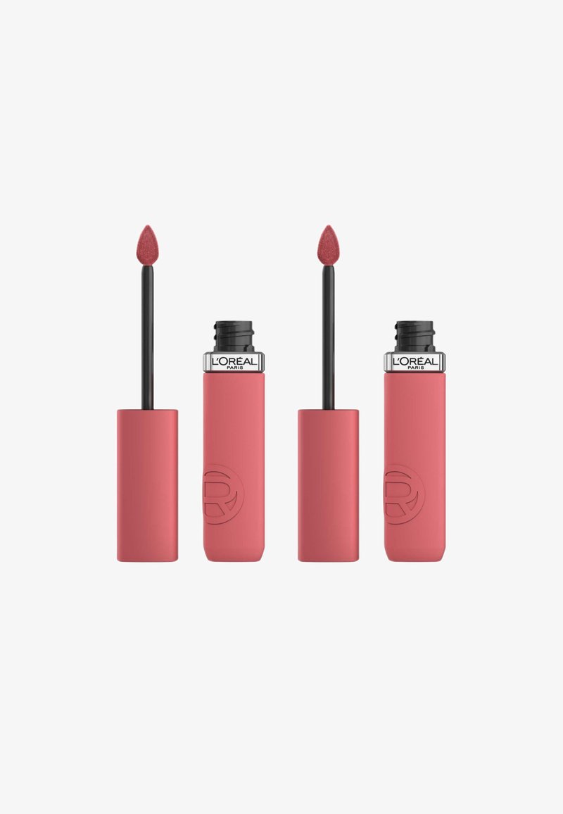 Produit à lèvres L'Oréal Paris dans un tube rose mat. Dispose d'un applicateur en mousse effilé et d'une texture lisse avec un design épuré.