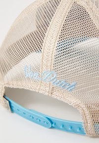 Beige mesh baseball cap with a blue adjustable snapback. Embroidered "Von Dutch" logo in light blue on the back.