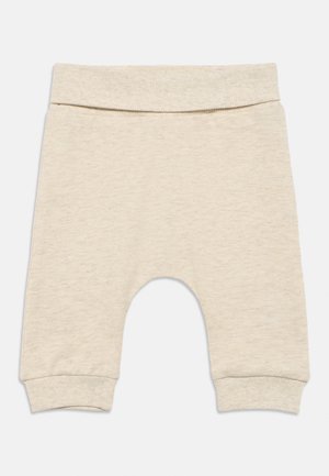 Pantalones de punto suaves para bebé en color beige, con cintura y puños elásticos, diseñados para ofrecer comodidad y facilitar el movimiento.