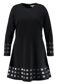 Musta venyvä mekko pitkillä hihoilla, jossa on hopeiset rei'itykset hihoissa ja helmassa, sekä pyöreä pääntie ja takavetoketju.