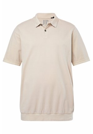 Beige Poloshirt mit kurzen Ärmeln, zwei schwarzen Knöpfen, gerippten Bündchen und einem taillierten Saum.
