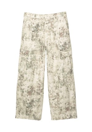 Loose-fit cargo pants with a beige, green, and brown splatter camouflage pattern and flap pockets on the thighs.