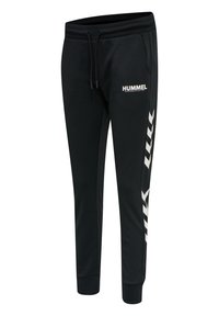 Zwarte sweatpants van zachte stof met een drawstring taille, een witte "HUMMEL" logo en witte diagonale strepen langs de zijkanten.