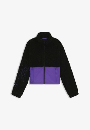 Zwarte fleece jacket met een paarse nylon ondersectie. Beschikt over een hoge kraag en ritszakken. Textuur boven met een gladde, strakke onderkant.