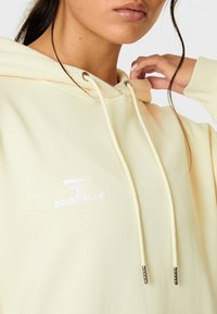 SQUATPROOF SP LEFT COMFY ACTIVE PUMP COVER  - Majica s kapuljačom - cream