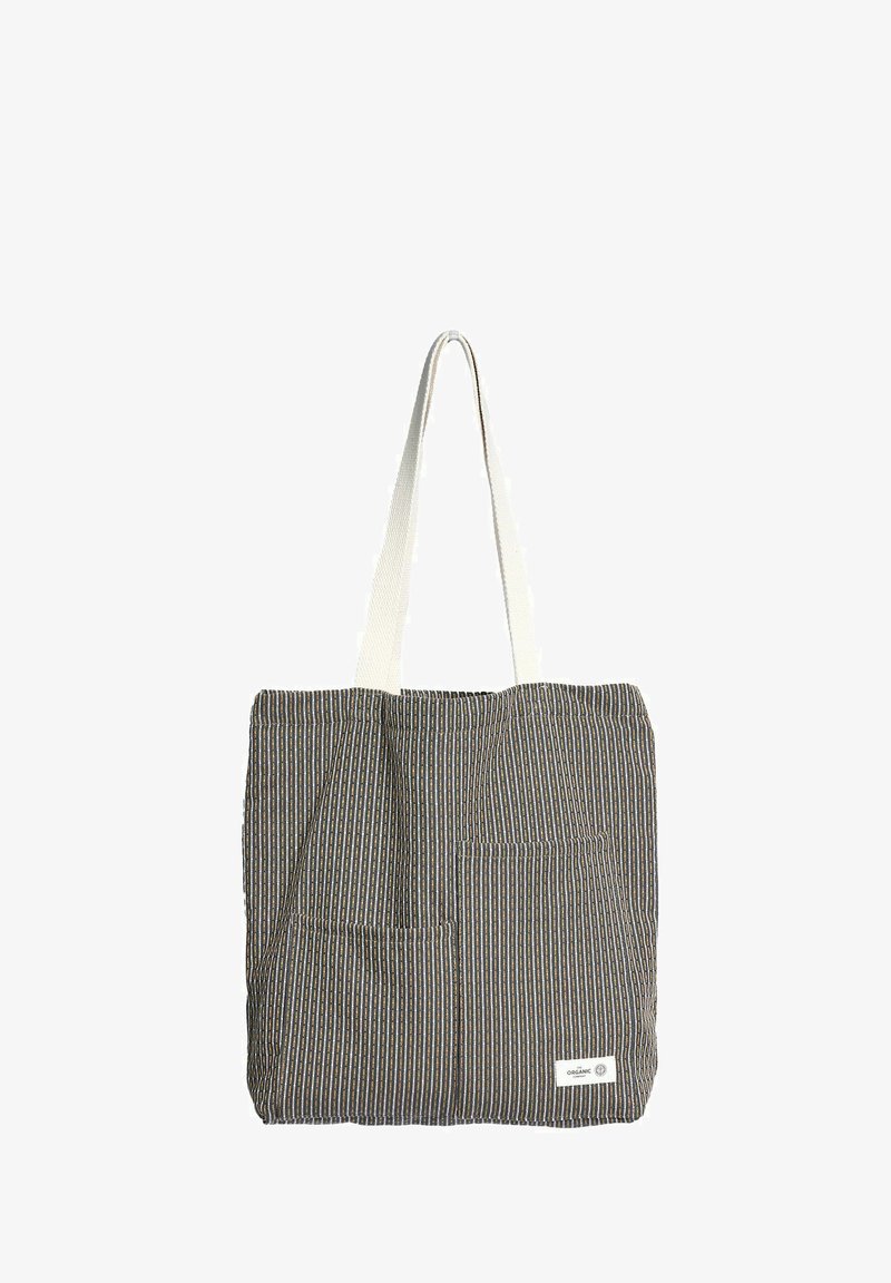 Platnena torba na pruge s dvije prednje džepa i bijelim naramenicama, sa malom oznakom "organsko" u donjem desnom kutu.