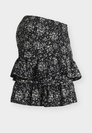 Μαύρη μίνι φούστα με λευκά λουλουδένια σχέδια, ελαστική μέση και διπλό στρώμα βολάν στο τελείωμα.