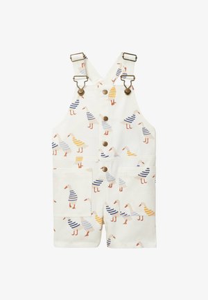 Salopettes blanches pour enfants avec des fermoirs métalliques, des boutons sur le devant et un motif d’oies portant des pulls rayés bleus et jaunes.