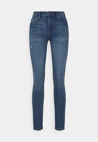 Jeans ajustados en denim azul oscuro, con un diseño clásico de cinco bolsillos, ligero desgaste en la parte frontal y una cintura de media altura.