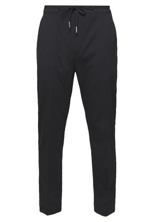 Pantaloni neri slim fit con sottili righe, vita elastica e chiusura con coulisse.