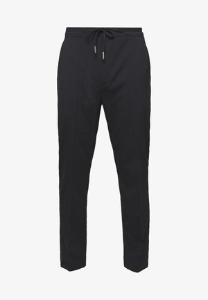 Pantalon slim noir à fines rayures, taille élastique et cordon de serrage.