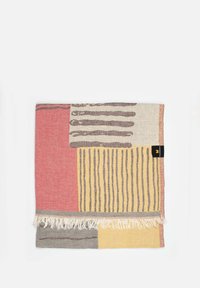 Multicolored woven blanket featuring stripes and geometric patterns in shades of red, yellow, and gray, with fringe detailing at one edge.