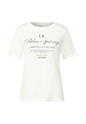 T-shirt bianco in cotone con maniche corte e scollatura rotonda. Testo nero centrato con caratteri di varie font, tra cui "L.A. Palm Springs" e "Abbraccia la Connessione."