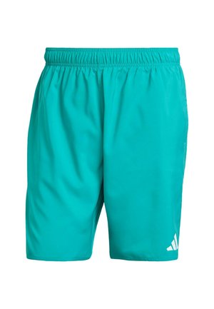 Pantalones cortos deportivos turquesa hechos de tejido suave; cuentan con una cinturilla elástica y un detalle del logotipo blanco en la esquina inferior derecha.