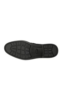Suola di scarpa in gomma nera con un motivo scanalato per un buon grip. Presenta un design piatto e una superficie liscia, adatta per diversi tipi di superfici.