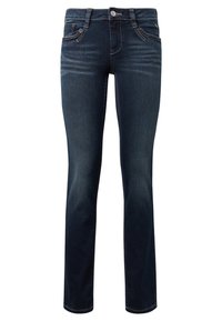 Jean slim bleu foncé avec poches avant, passants de ceinture et fermeture par bouton, montrant des détails subtilement décolorés sur les cuisses.