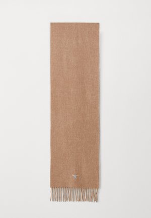 Brown knitted scarf with fringed edges, made from soft material. Notable logo detail near the bottom edge.
