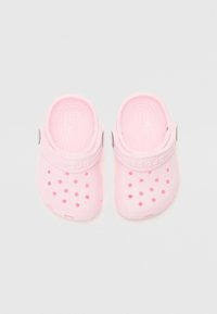 Pink rubber clogs with circular ventilation holes, molded design, and a raised heel. Features a strap with a logo on the side.