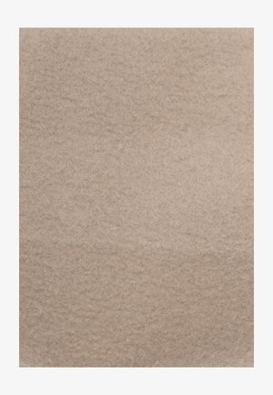 Light beige felt material with a soft, textured surface, featuring a uniform appearance and subtle variations in color.