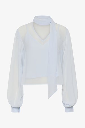 Blusa blanca transparente de manga larga con escote en V, lazo tipo bufanda incorporado y mangas globo con puños.