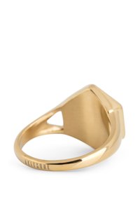 Gold ring with a smooth, polished finish. Features a geometric shape and an open design with a triangle cutout. Brand marked on the band.