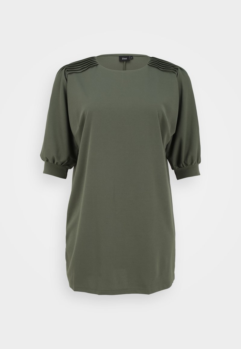 Blouse verte olive pour femme avec manches courtes bouffantes, détails plissés aux épaules et encolure ronde.
