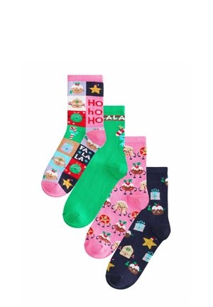 Four colorful Christmas-themed socks with festive patterns including pudding, stars, gifts, candy canes, gingerbread, and holiday text.