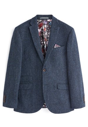Blazer bleu marine en chevrons pour homme avec doublure intérieure florale et pochette assortie, fermeture à un bouton et trois boutons à chaque manche.
