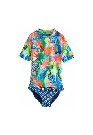 Maillot de bain à manches courtes, multicolore, avec un motif floral tropical sur le haut et un bas bleu à motifs avec des accents froncés. Tissu extensible.