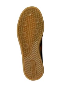 Rubber shoe sole with a light brown color, patterned with circular grips and a zigzag texture. Features prominent branding on the side.