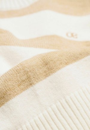 Gebreide trui stof met afwisselende crème en beige strepen. Zachte textuur met geribbelde zoom en subtiel logodetail in beige.