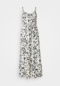 Robe maxi en tissu blanc avec un motif de feuilles noires, bretelles fines, taille nouée et coupe décontractée. Adaptée aux occasions par temps chaud.