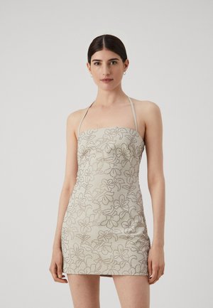 Strapless mini dress in light beige with floral embroidery design; fitted silhouette, smooth texture, and thin shoulder straps.