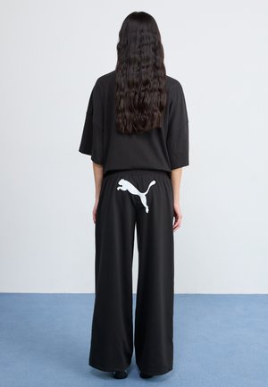 Puma RELAXED PANTS - Tracksuit bottoms - black