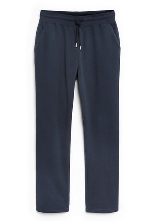 Pantalones de chándal azul marino hechos de una tela suave, con una cintura con cordón, dos bolsillos laterales y puños elásticos en los tobillos.