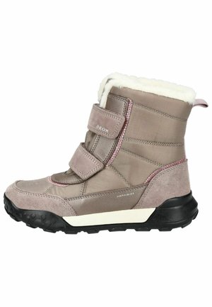 Wasserabweisende beigefarbene Stiefel mit weicher Kunstfell-Lining, doppelten Klettverschlussriemen und einer strukturierten Gummisohle für besseren Halt.