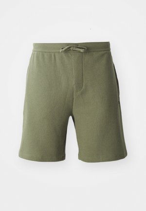 Olive zöld, textúrált anyagból készült rövidnadrág, húzózsinórral a derékon és két oldalzsebbel, középhosszú, a comb közepéig érő fazonnal.