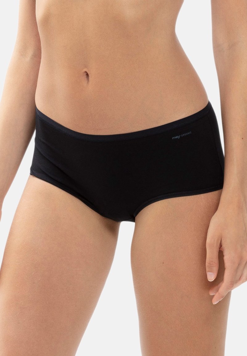 Culotte hipster en coton biologique noir avec une texture lisse et une taille élastique. Comprend un branding subtil sur le côté.