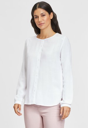 Weiße Langarm-Bluse mit Knopfverschluss aus leichtem Material, mit runder Halslinie und geradem Saum. Sie hat kleine Knöpfe auf der Vorderseite.