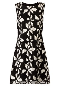Robe sans manches noire ornée d'un motif floral blanc avec des pétales soulignés. Le tissu semble texturé avec une finition lisse et une silhouette structurée.